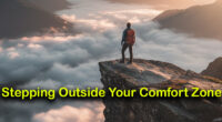 A person stands on the edge of a mountain cliff overlooking a vast, beautiful landscape at sunrise, symbolizing courage and stepping beyond one's comfort zone.